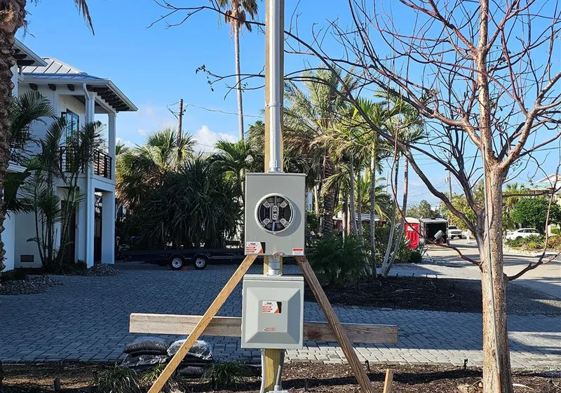 Temporary power pole installed at a construction site
