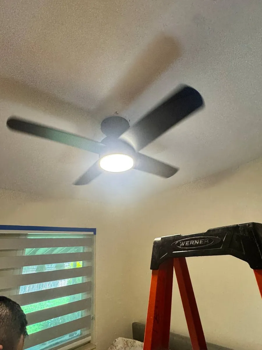 New ceiling fan with integrated LED light in a bedroom