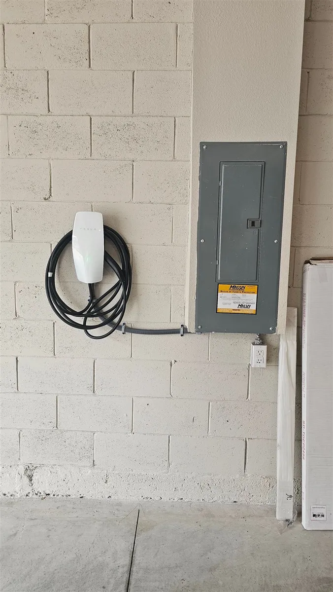 EV charger mounted on garage wall