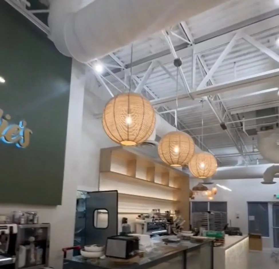 Rattan pendants over a cafe service counter