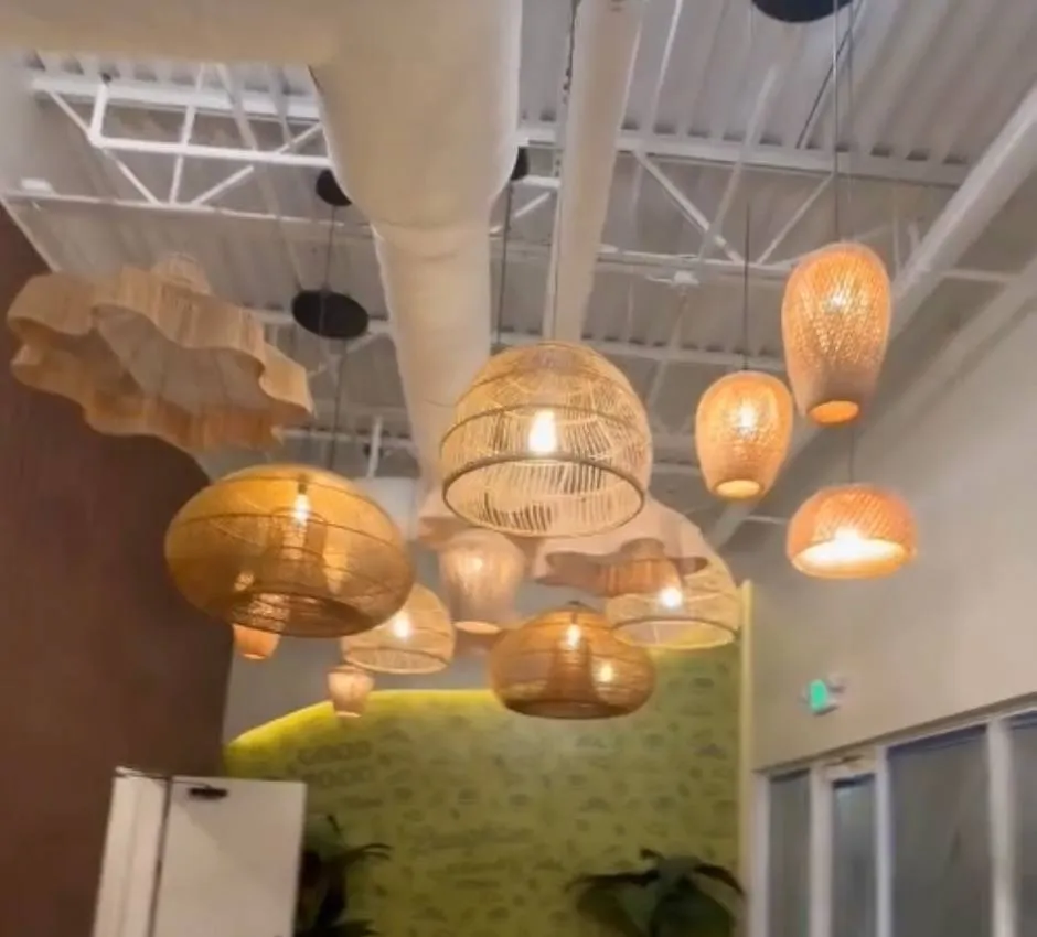 Cluster of rattan pendant lights over a restaurant dining area