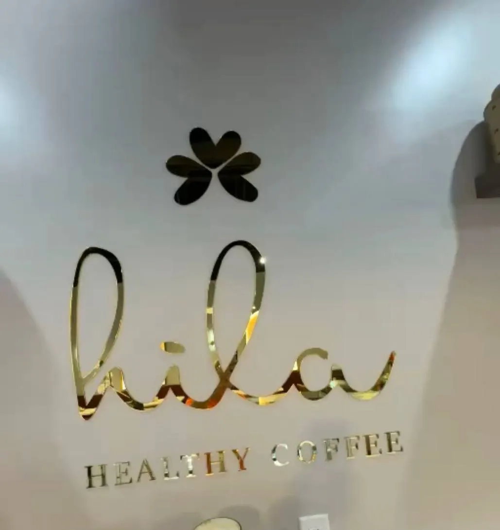 Gold mirror storefront sign for a healthy coffee shop